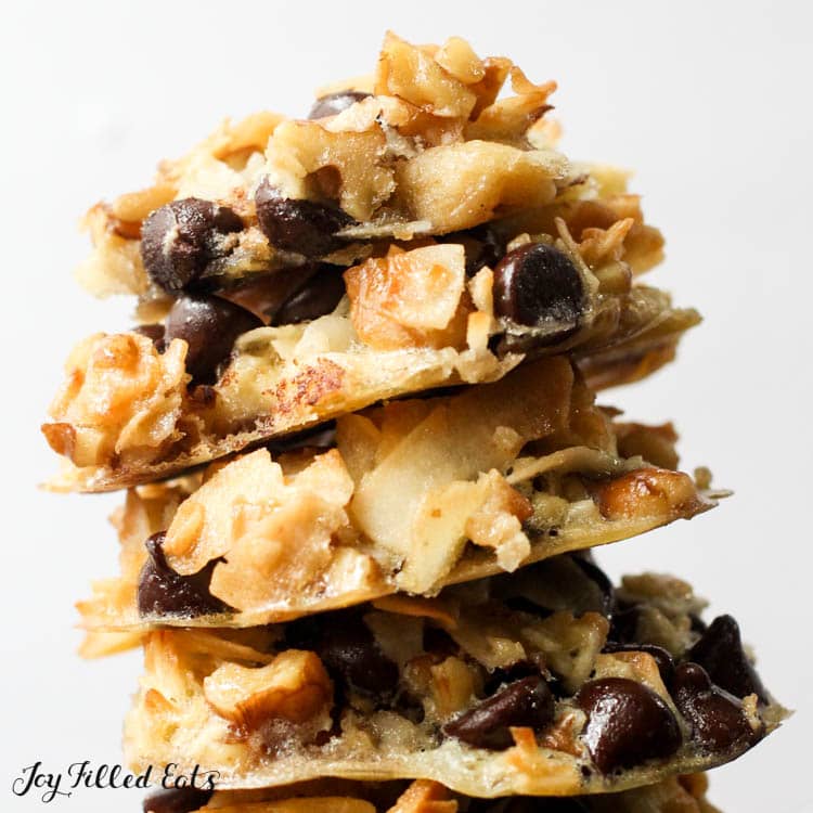 low carb keto magic cookies stacked up on a white background