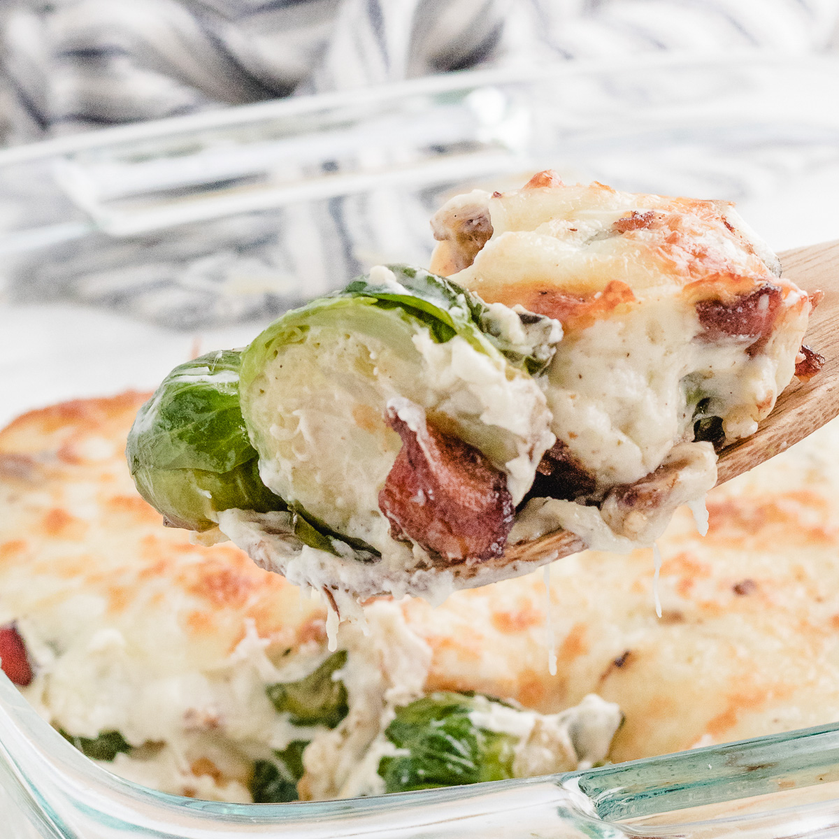 brussel sprouts casserole with bacon on a spoon