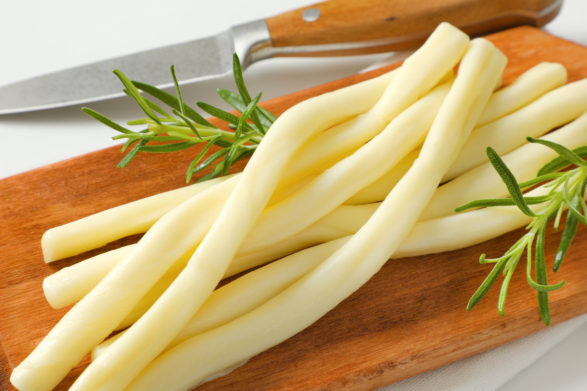 dairy options that work for a ketogenic diet including cheese on a cutting board
