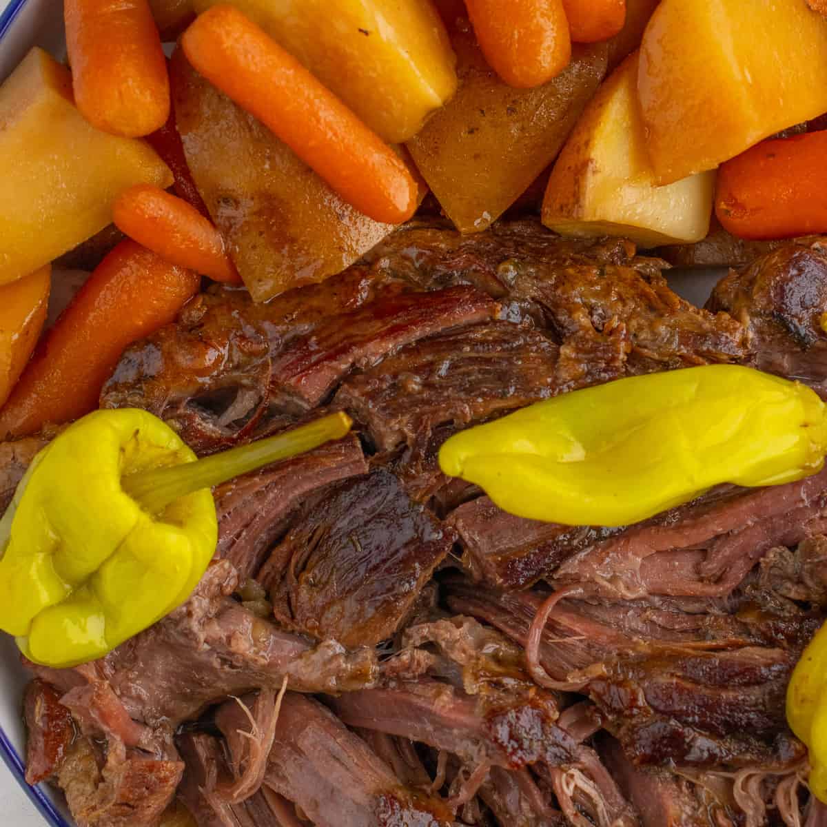 mississippi pot roast with veggies such as carrots and potatoes after cooking