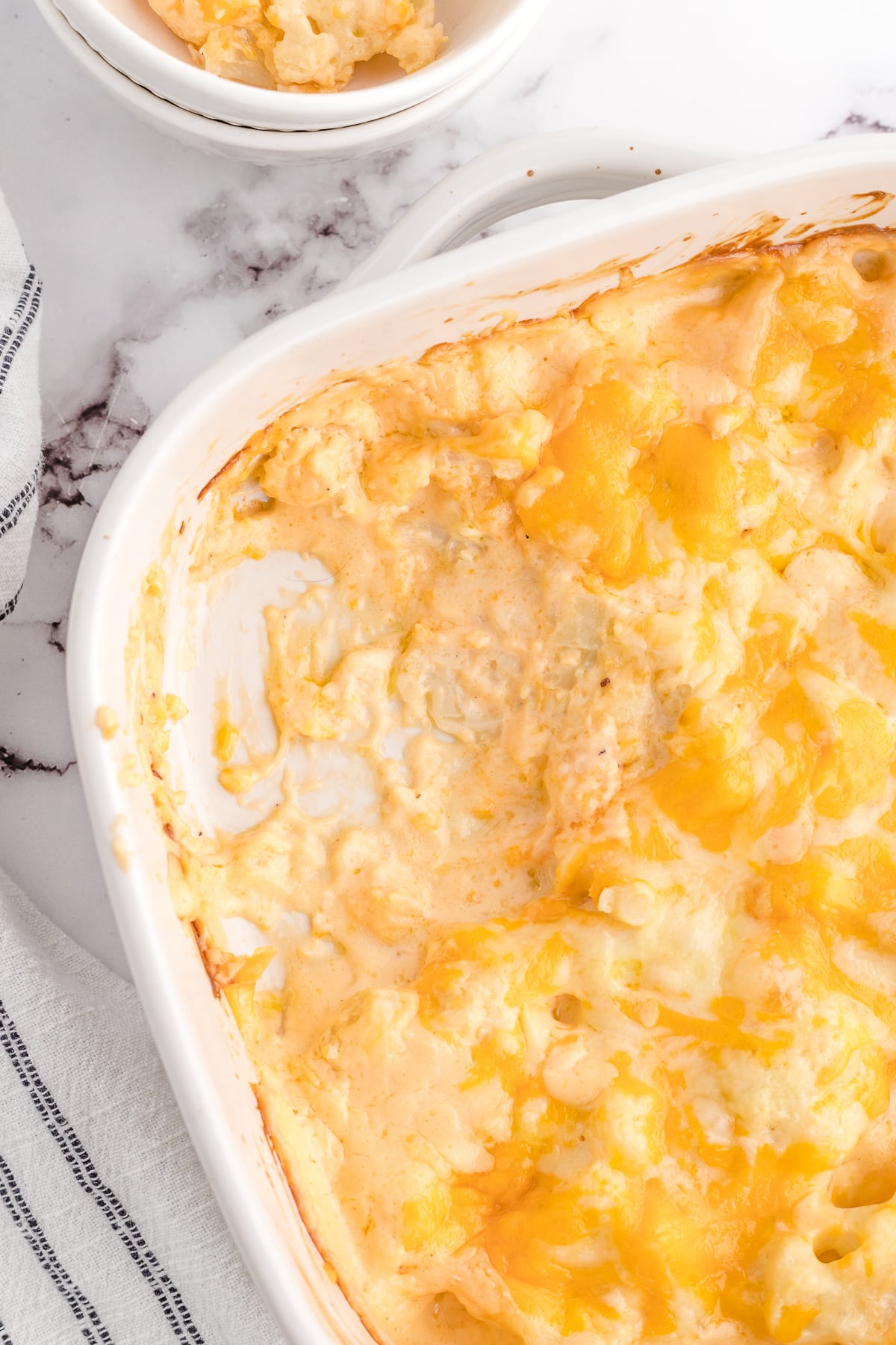 low carb mac and cheese with a scoop taken out of the casserole dish