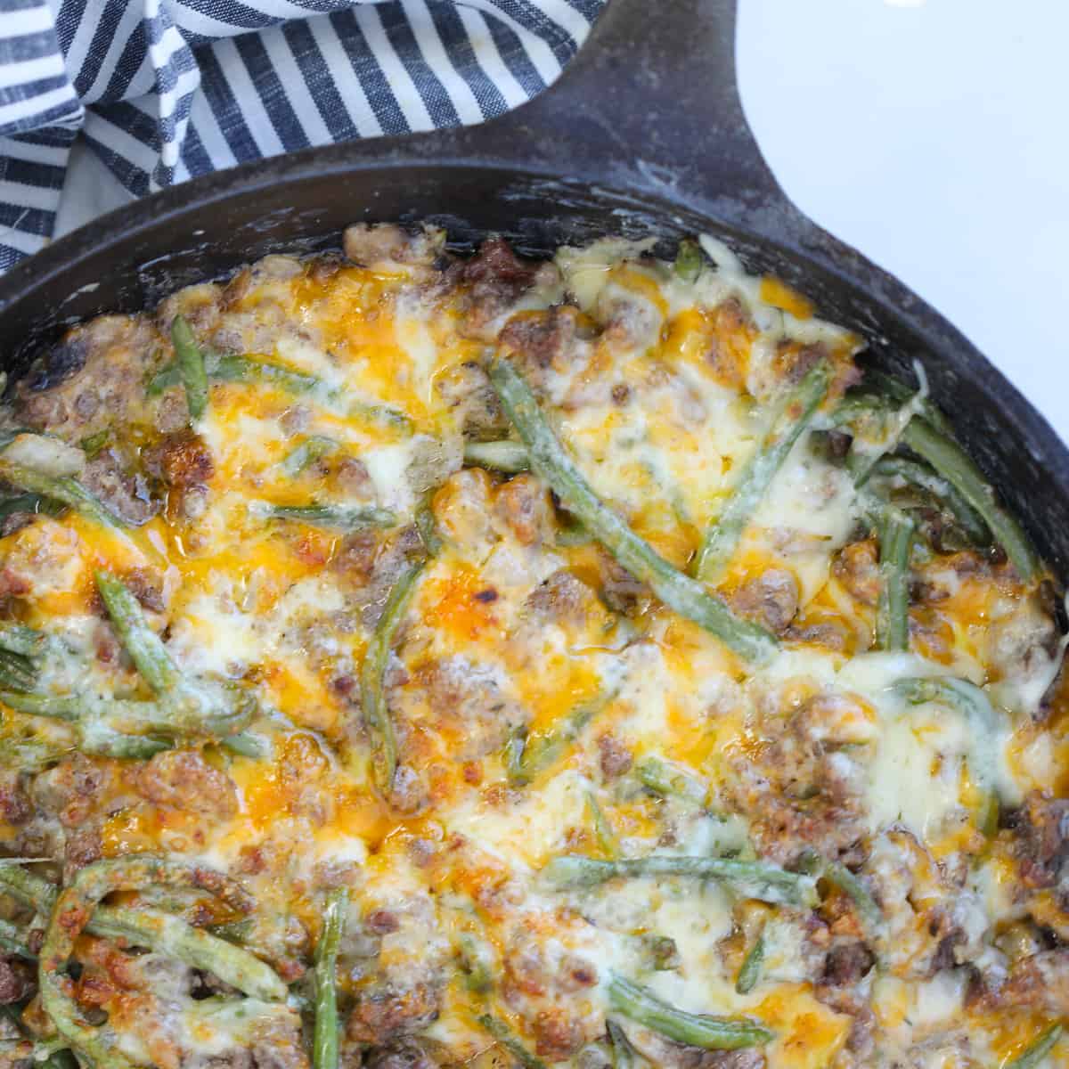 hamburger green bean casserole in a cast iron skillet after cooking