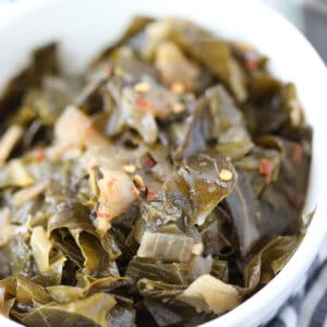 vegan collard greens recipe closeup image with hot sauce