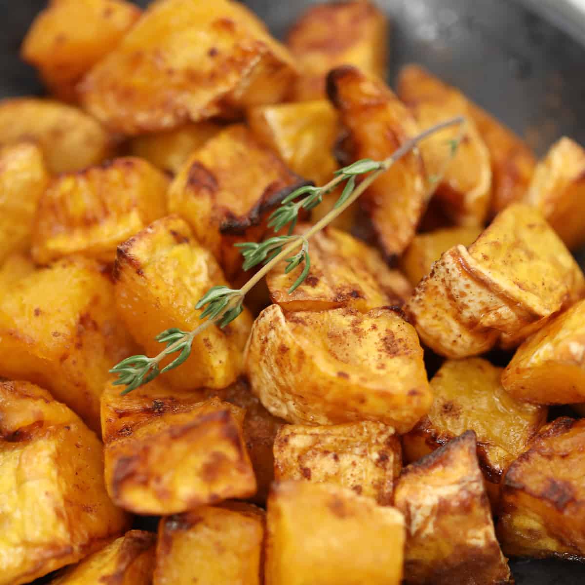 closeup view of butternut squash in an air fryer recipe