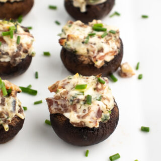 low carb stuffed mushrooms without breadcrumbs on a white plate