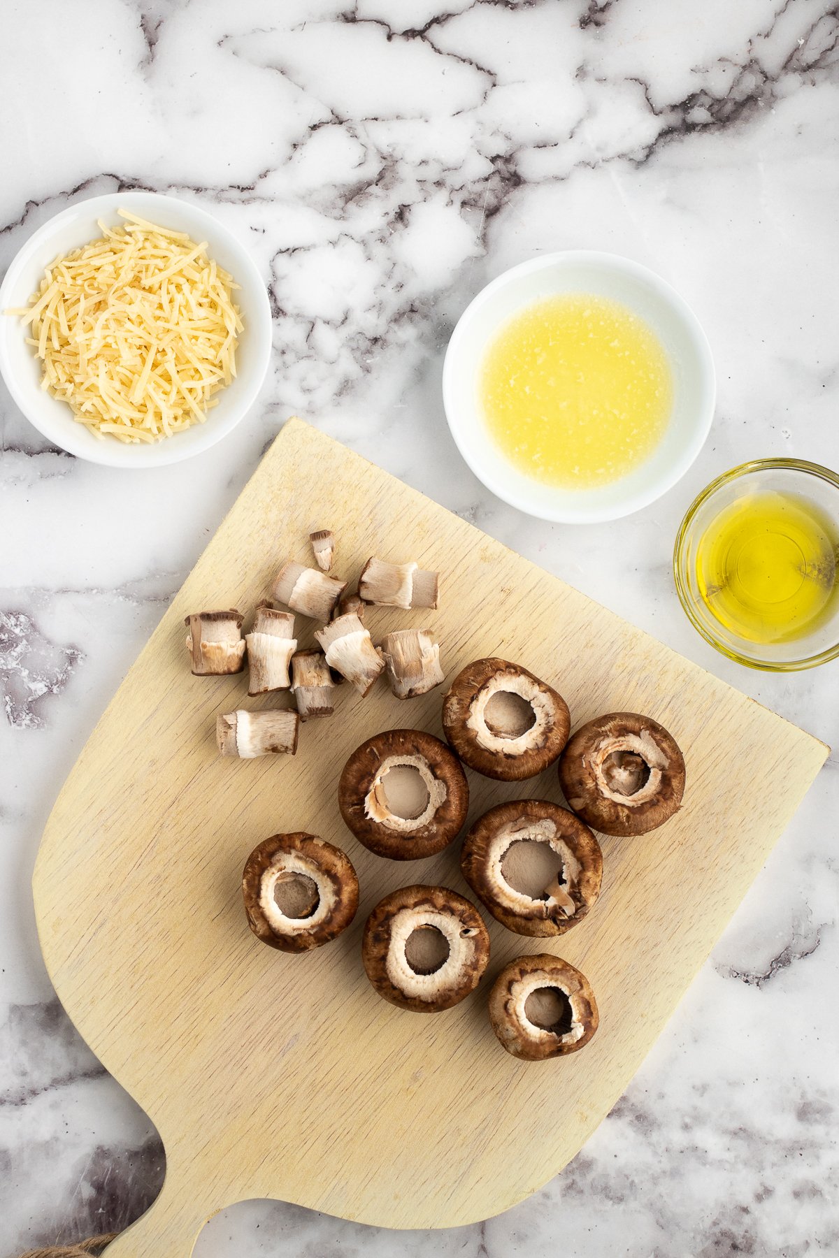 removing the mushroom caps for the stuffed mushrooms recipe