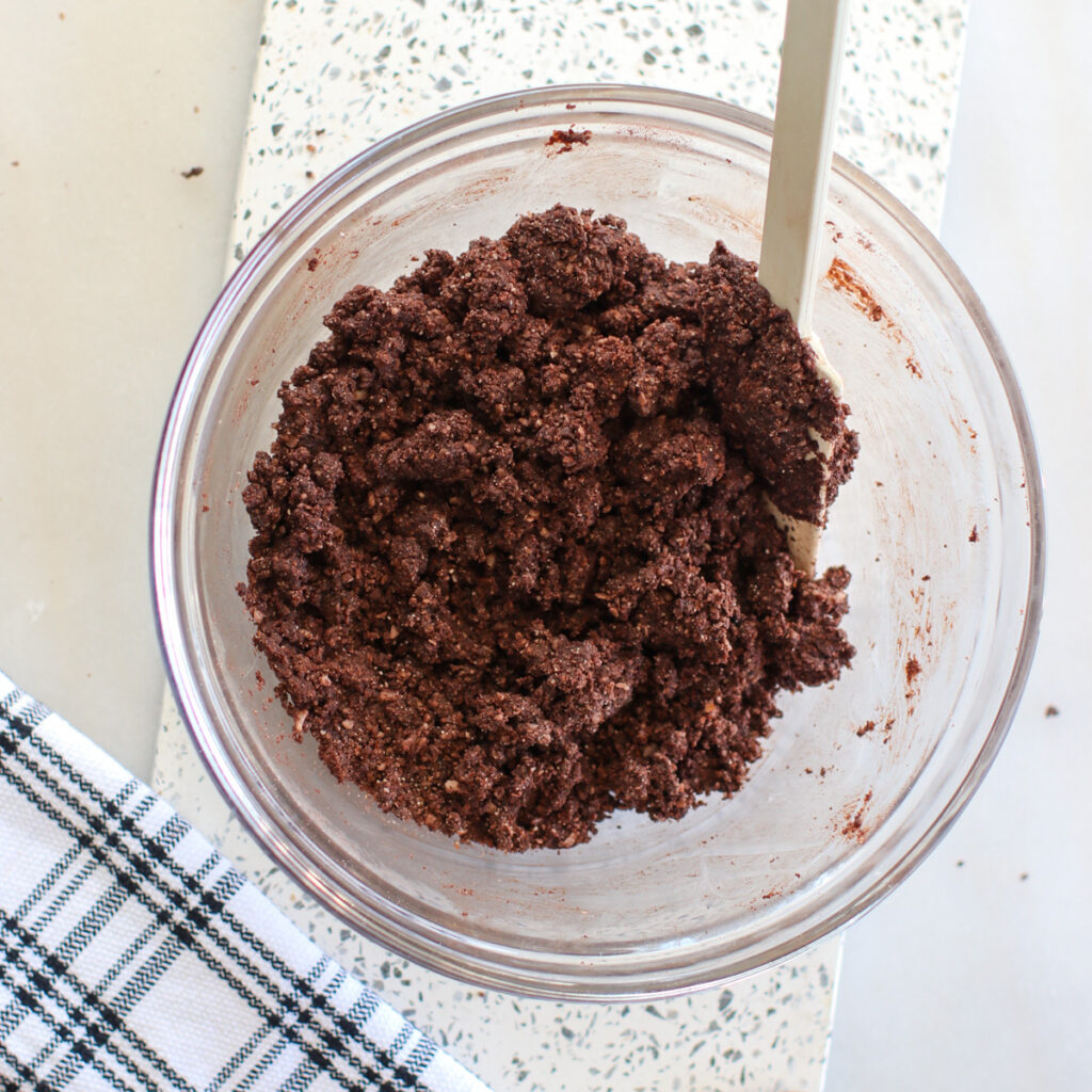 mixing the low carb rum ball mixture in a bowl