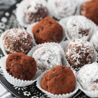 keto candy recipes like low carb rum balls covered with coconut in a white wrapper