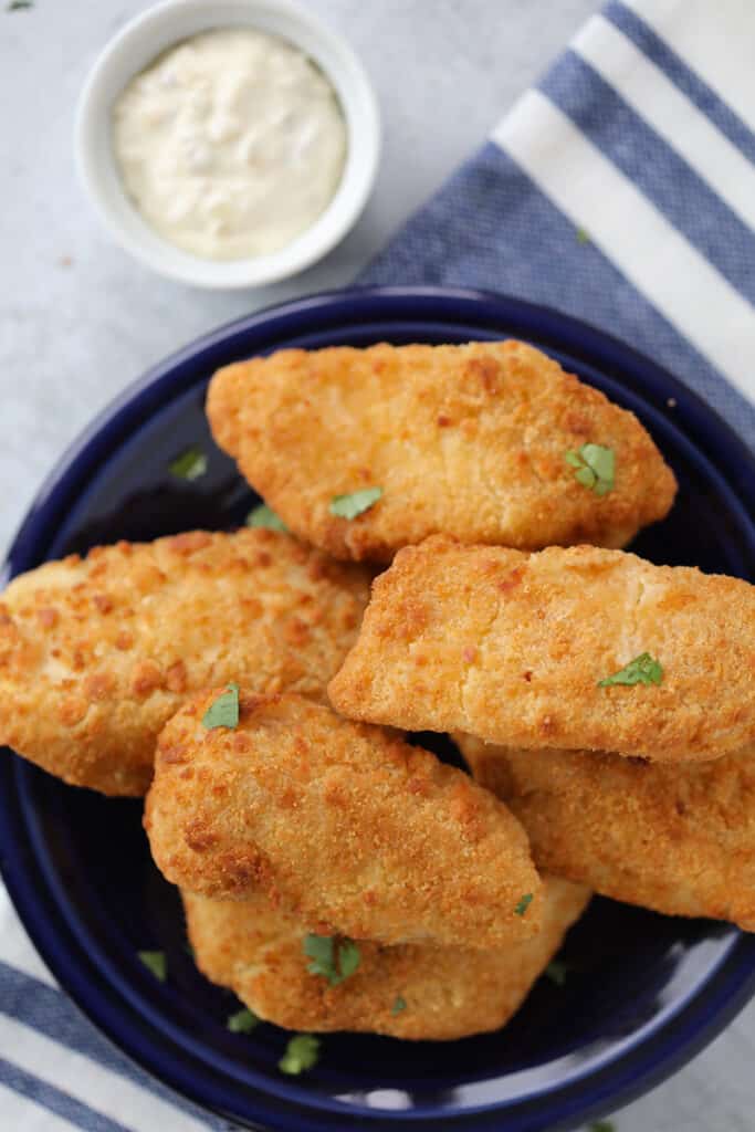 https://wholelottayum.com/wp-content/uploads/2020/12/air-fryer-frozen-fish-683x1024.jpg