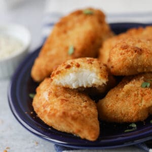 the frozen fish in air fryer recipe with a bite out of a piece after cooking