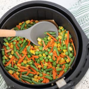 air fryer frozen vegetables medley getting stirred