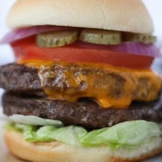 frozen burgers in air fryer recipe loaded with toppings on a bun
