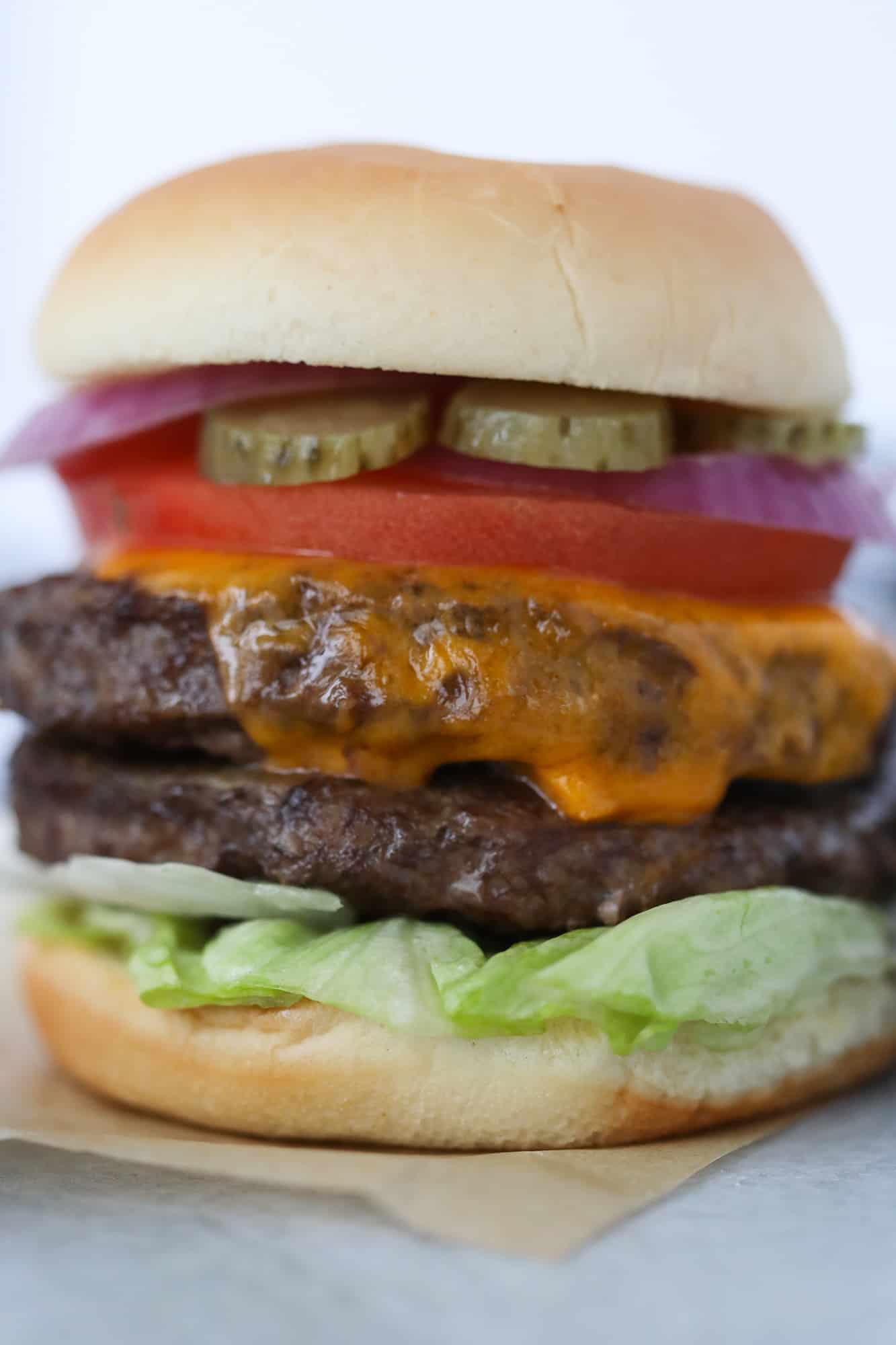 frozen burgers in air fryer recipe loaded with toppings on a bun