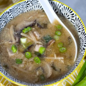 pressure cooker hot and sour soup in a bowl with an Asian spoon