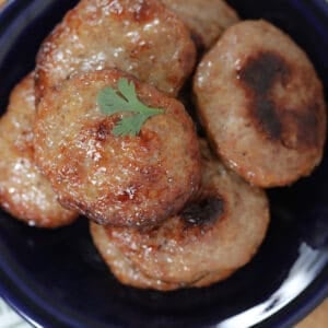 sausage patties in oven up close on a plate after cooking