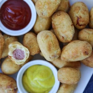 mini corn dogs air fryer close-up with a bite out of a frozen corn dog
