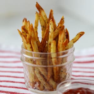 french fries in air fryer in a mason jar standing up