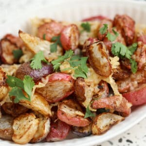 close up of radishes in air fryer with cheese