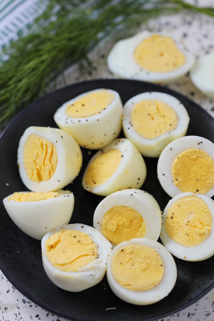 air fryer hard boiled eggs sliced in half after cooking with a creamy center