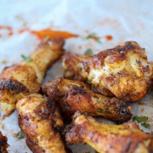 baked cajun style dry rub wings stacked together ready to eat