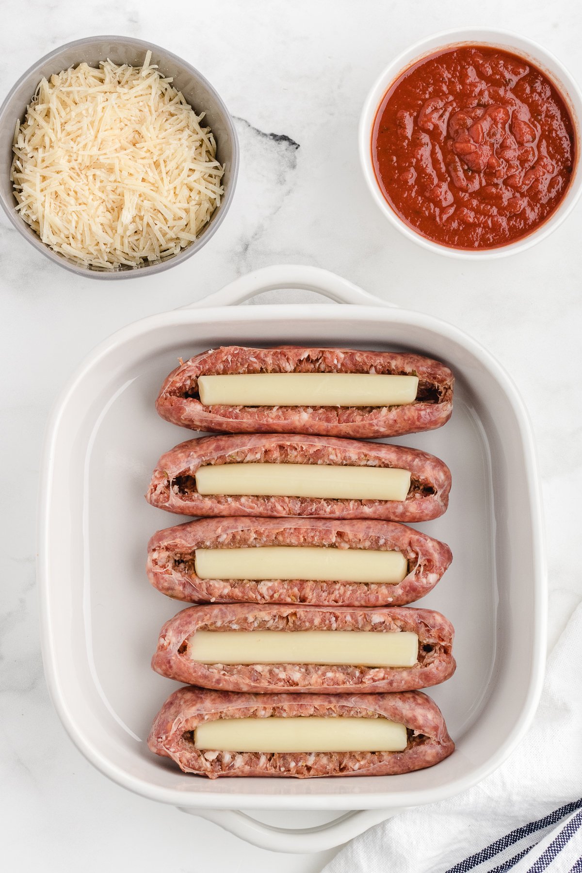 italian sausage with cheese inside before cooking in the pan