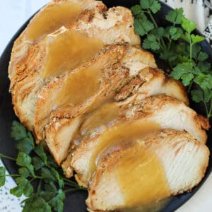 boneless turkey breast in air fryer sliced on a serving plate