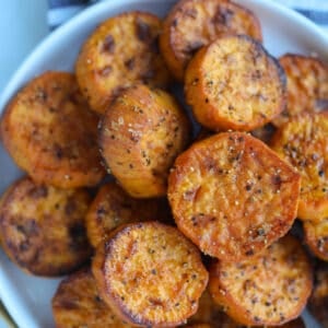 sweet potato slices air fryer on a plate after cooking