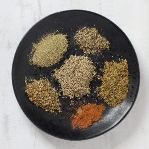 homemade substitute for poultry seasoning in a small bowl before stirring together
