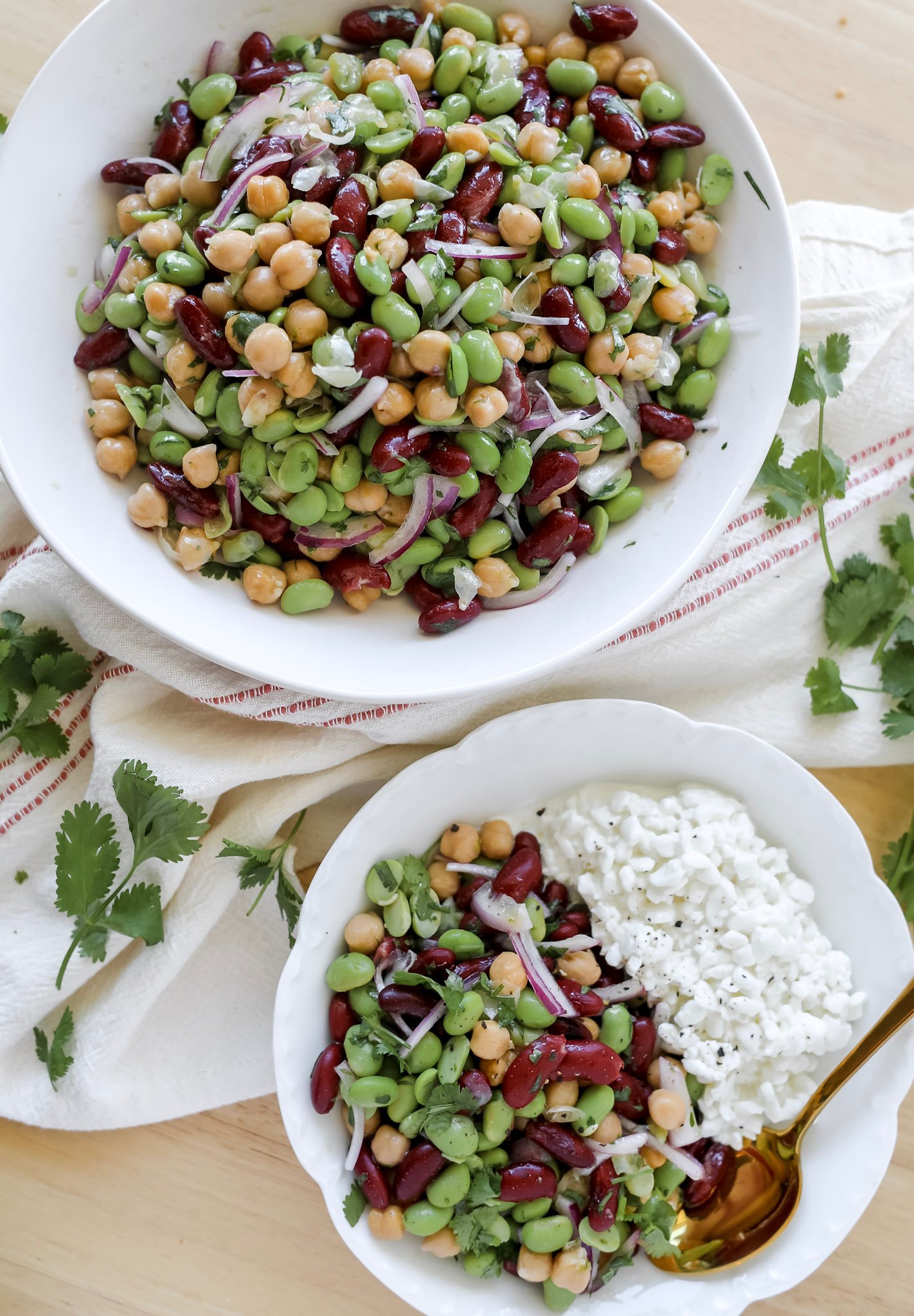 a healthy edamame bean salad with garbanzo beans and kidney beans in a simple lime dressing