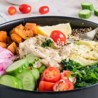 mediterranean bowl served with a fork.