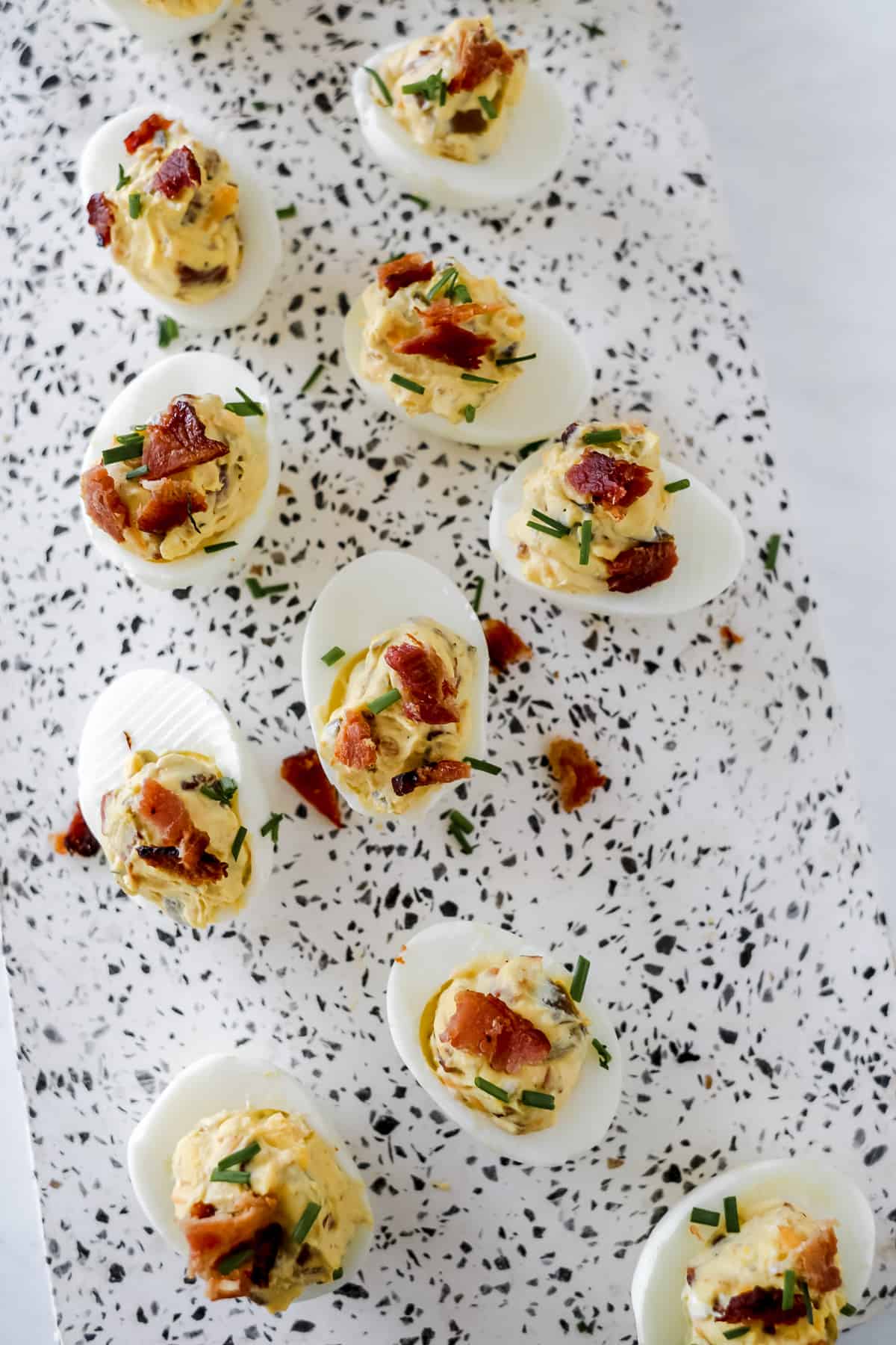 Close up of garnished bacon jalapeno deviled eggs.