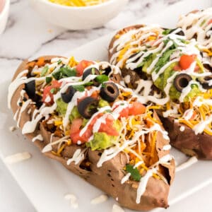 Mexican stuffed sweet potatoes ready to serve on a plate.