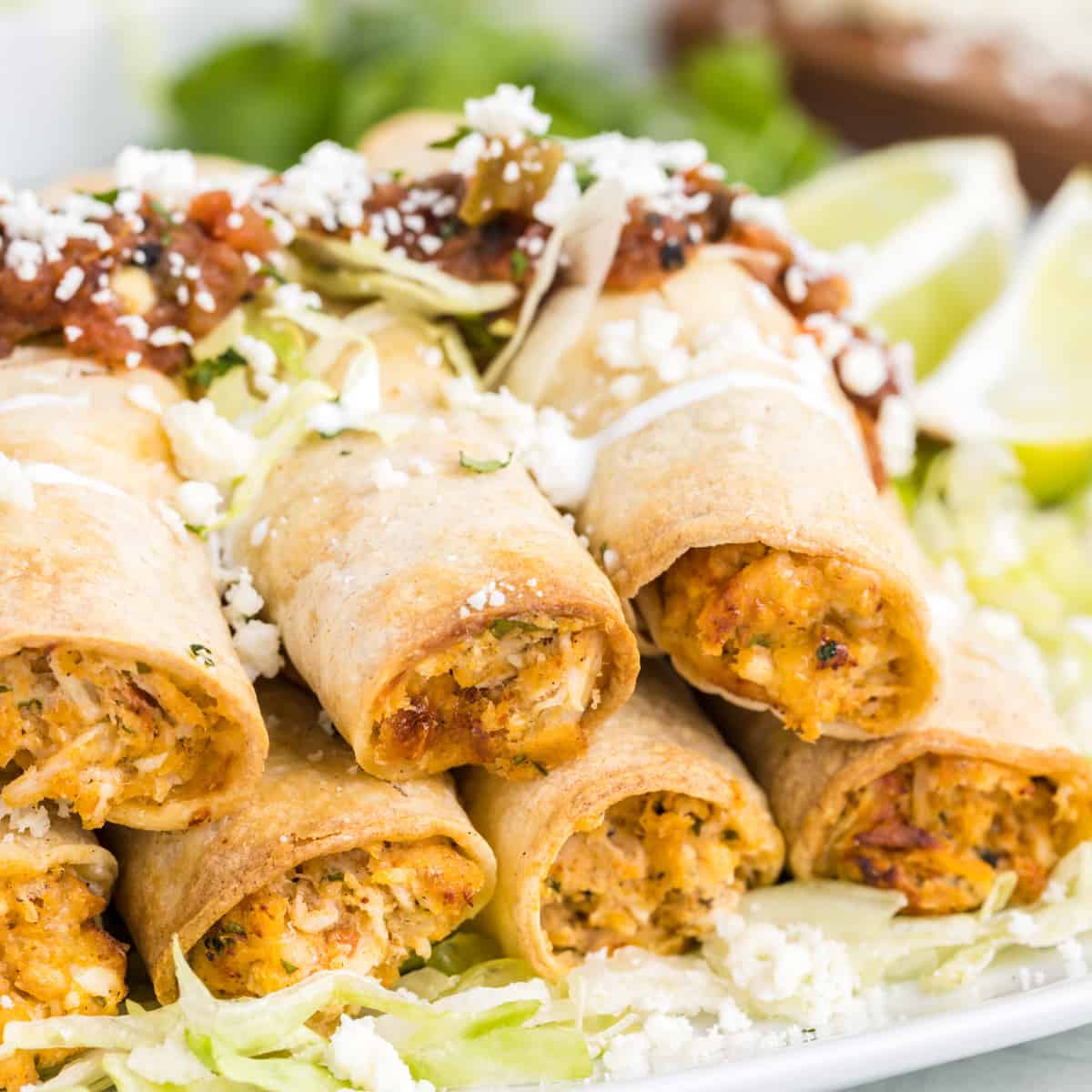 Platter of homemade air fryer chicken taquitos.