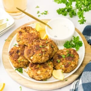 Fresh crab cakes being served on a plate.