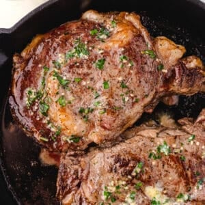 cast iron ribeye steak in the pan