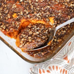 close up on a spoon of sweet potato casserole no marshmallows