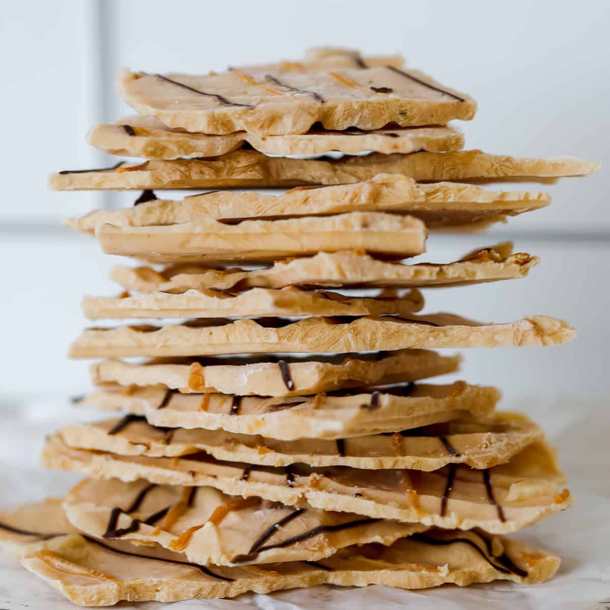 stacked up peanut butter yogurt bark drizzled with chocolate