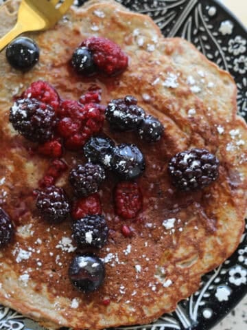 protein pancakes with protein powder and banana close up on a plate