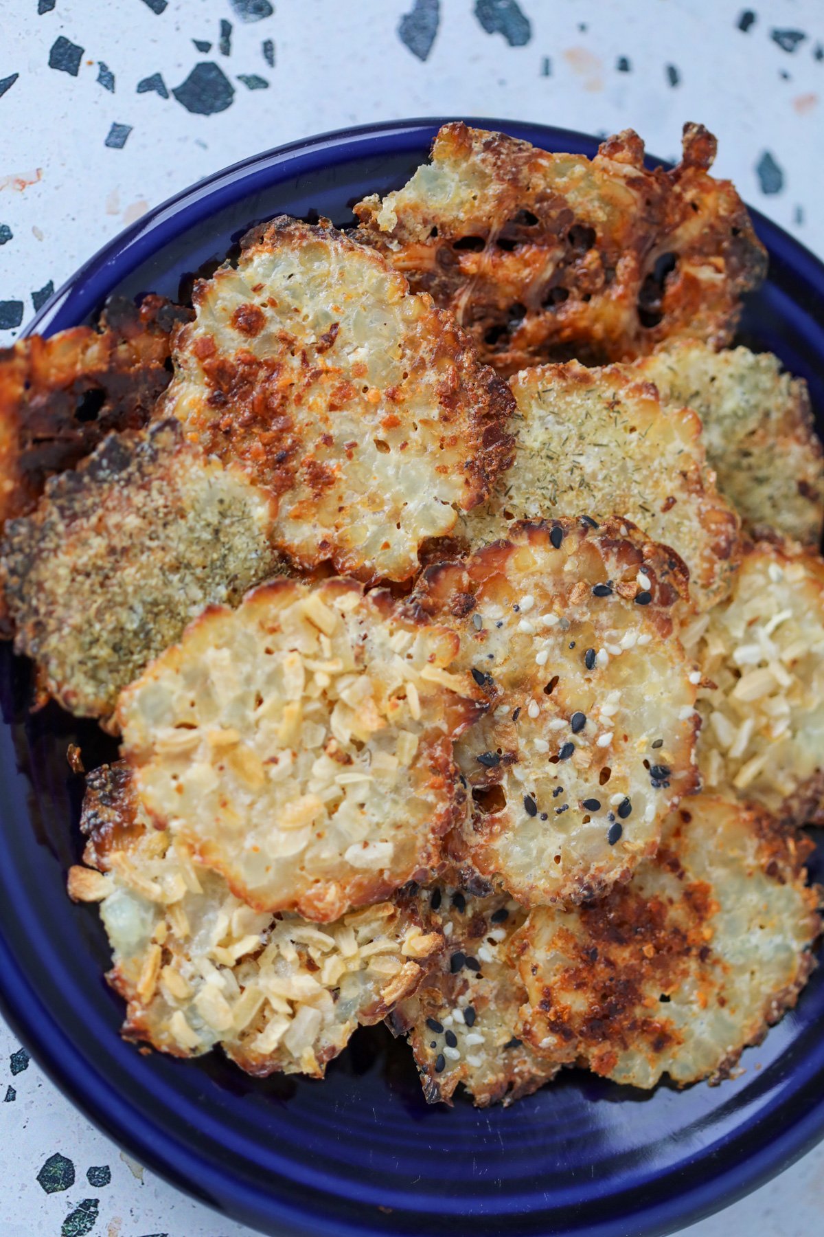 homemade cottage cheese chips on a blue plate ready to eat