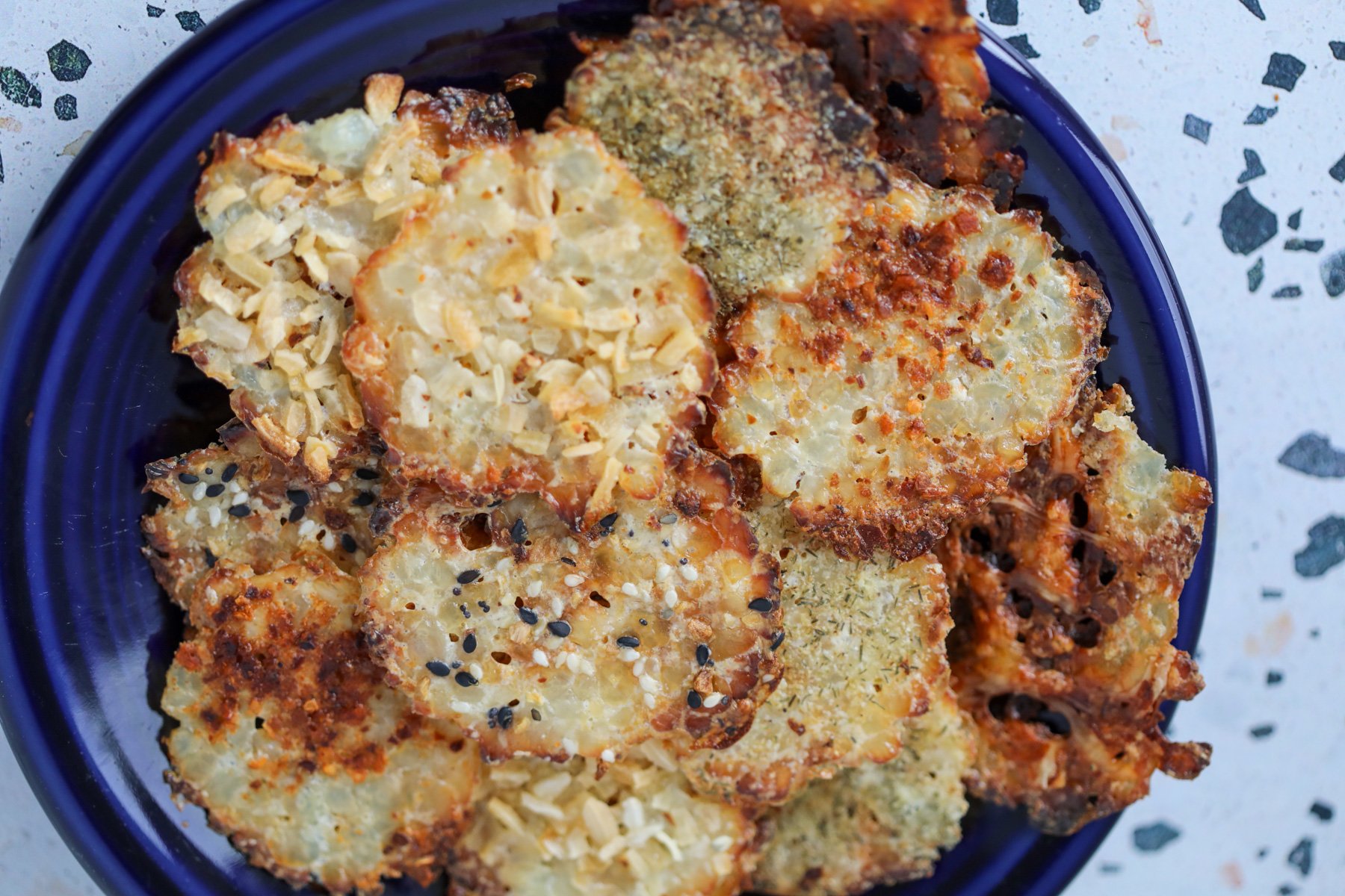 crispy cottage cheese chips stacked up on a plate