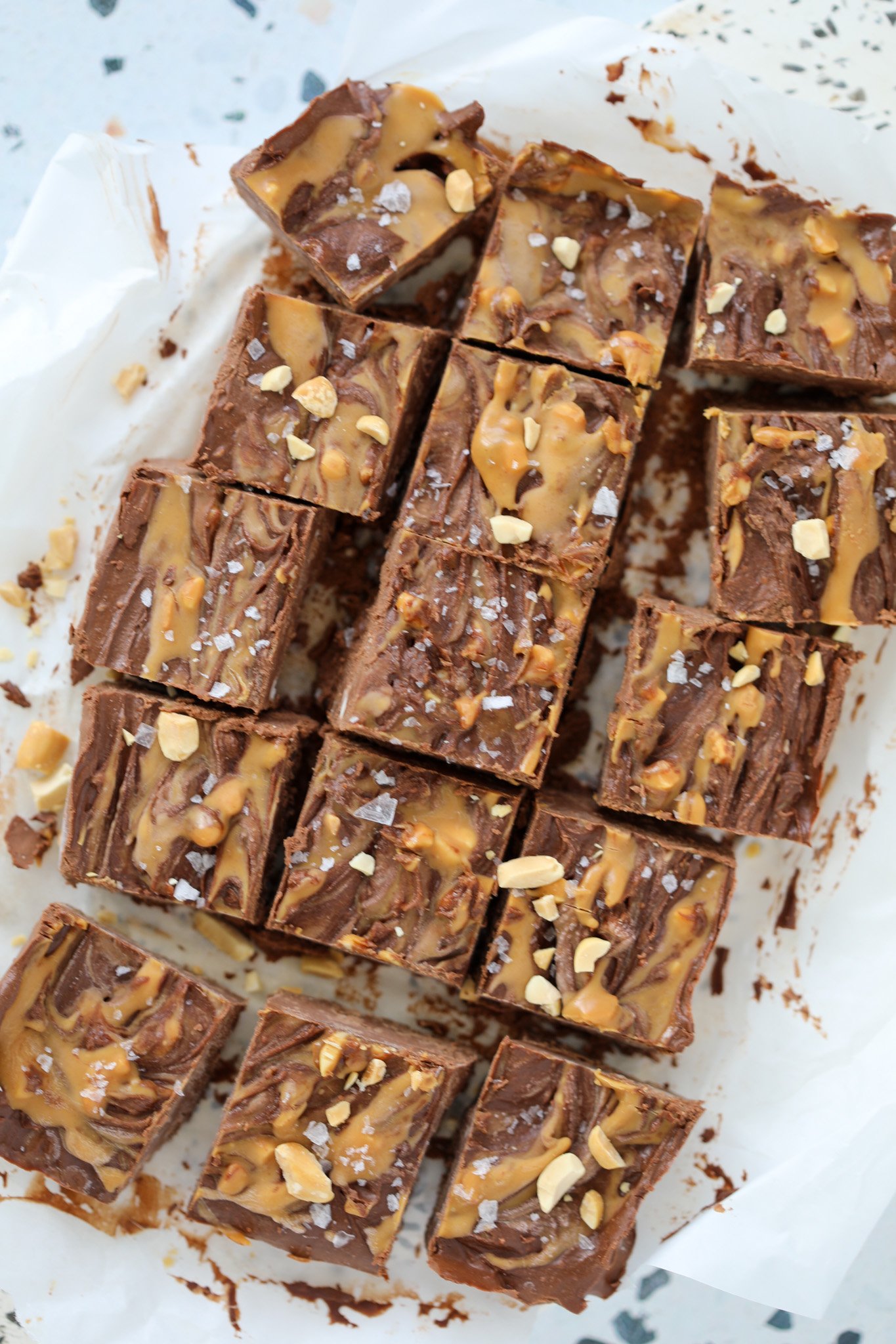 high protein fudge with cottage cheese chocolate and peanut butter cut up on a cutting board into squares ready to eat