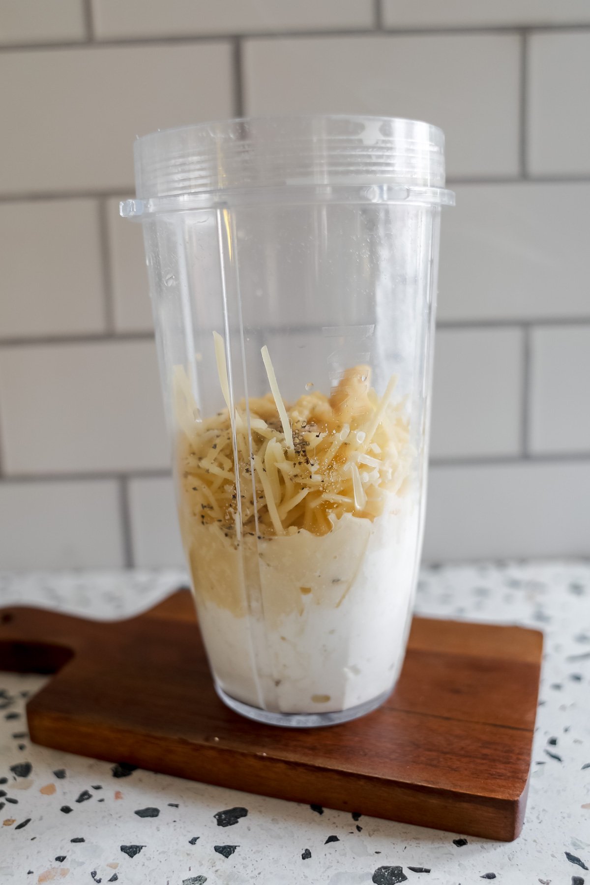 blending the cottage cheese alfredo ingredients in a high speed blender