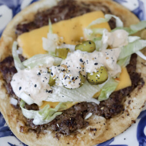 big mac smash tacos loaded with lettuce pickles american cheese and big mac sauce before eating