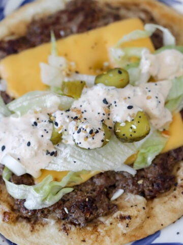 big mac smash tacos loaded with lettuce pickles american cheese and big mac sauce before eating