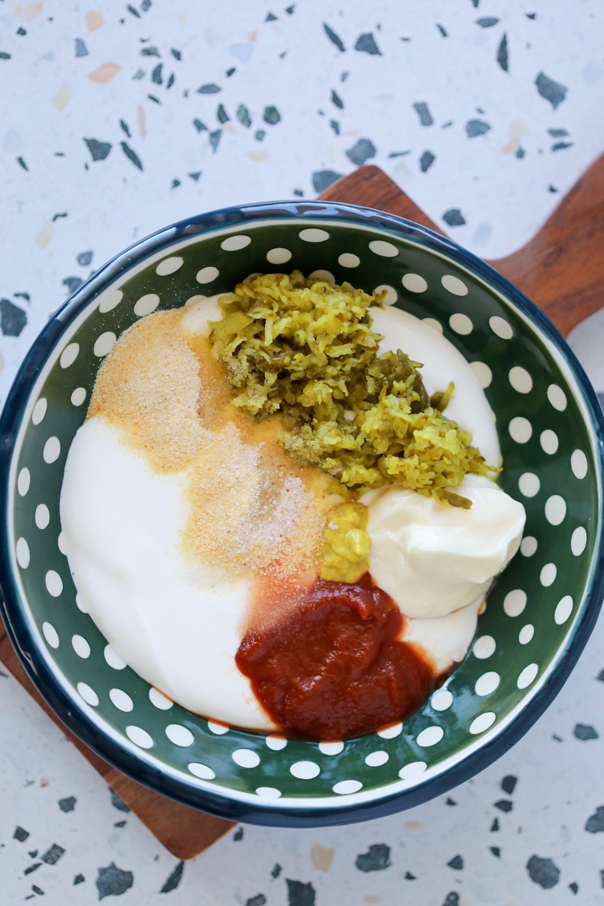 adding the big mac sauce ingredients to a bowl before combining them