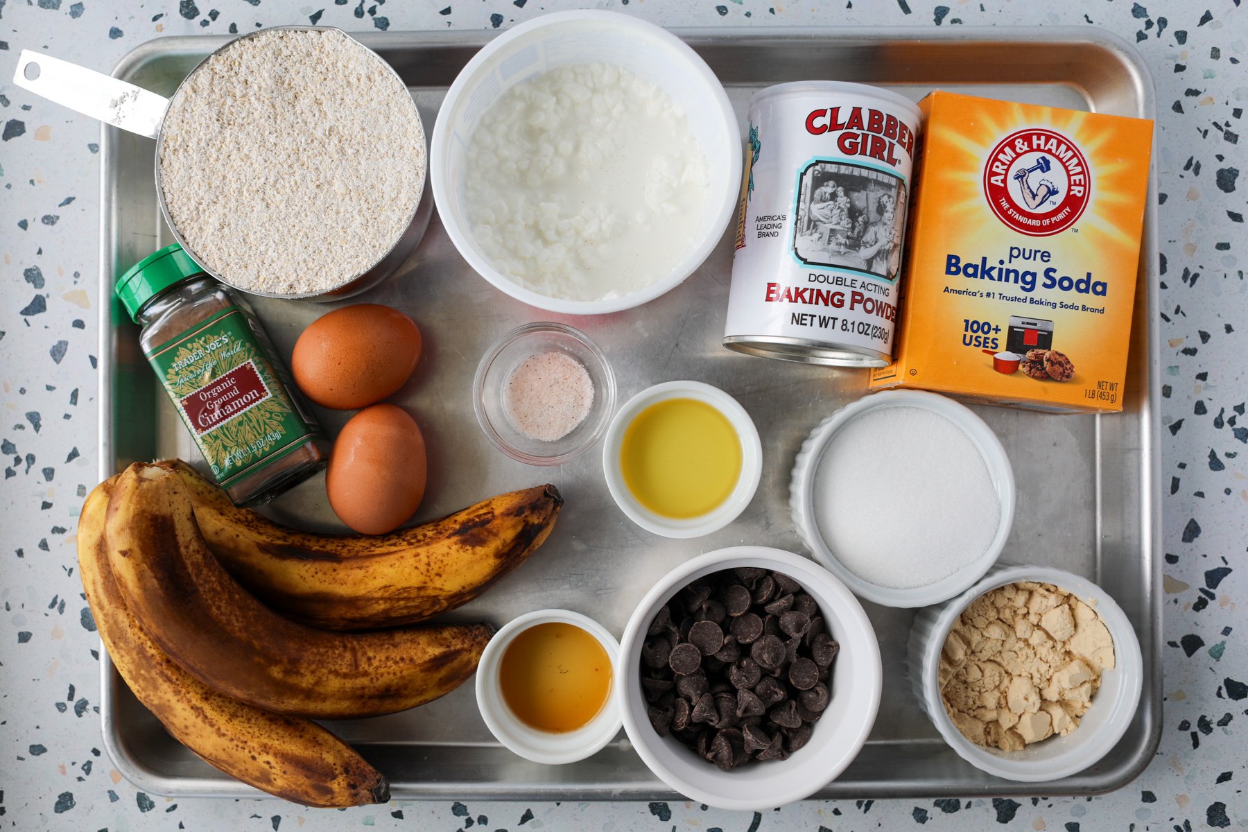 banana protein muffins ingredients on a baking tray