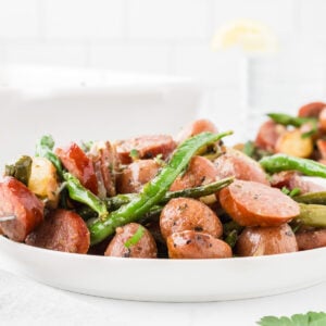 crockpot swamp potatoes recipe close up image with sliced smoked sausage fresh green. beans and red potatoes