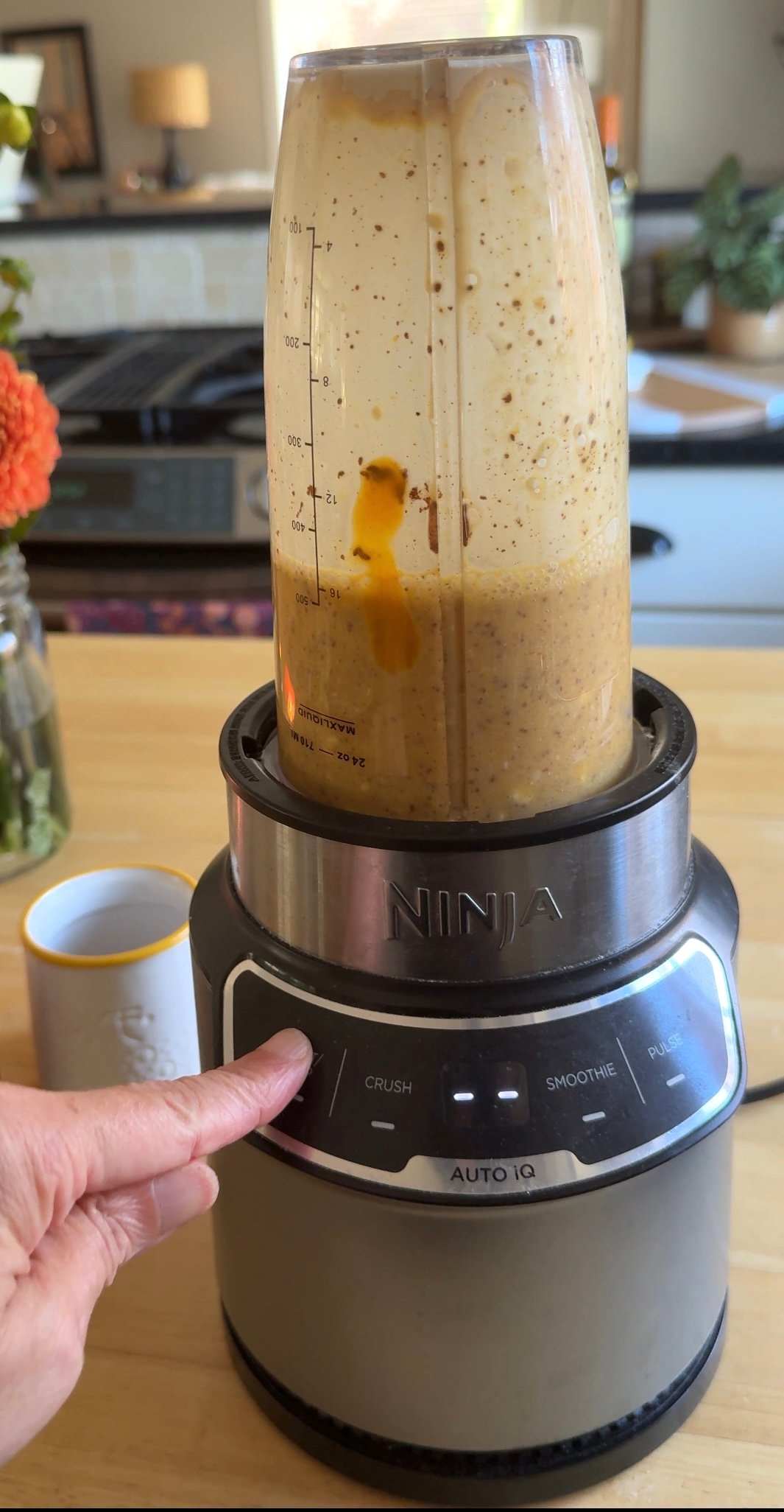 protein pumpkin smoothie with cottage cheese getting pureed in a blender