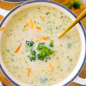 creamy bowl of high protein broccoli cheddar soup with spoon