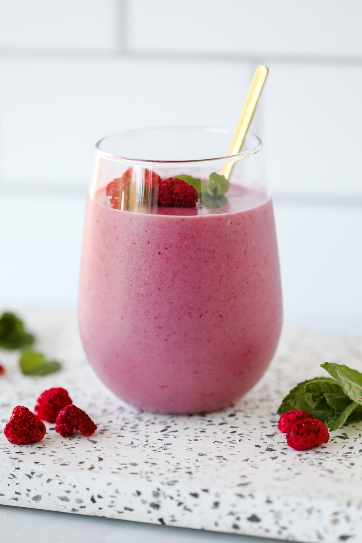 a healthy rasberry smoothie with no yogurt on a white background